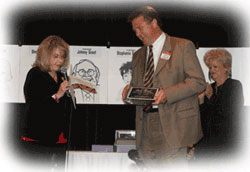 Dan smith receiving publicist of the year award
