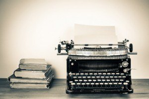 Image of an author writing a book on a typewriter. Smith publicity can get your book published with their professional book marketing services, book publicity strategies, and book promotion campaigns.