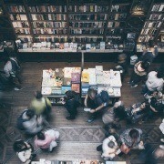 An author at a book signing event at a bookstore. Tips for getting bookstores to agree to a book signing event to help you sell books.