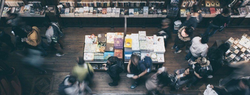 An author at a book signing event at a bookstore. Tips for getting bookstores to agree to a book signing event to help you sell books.