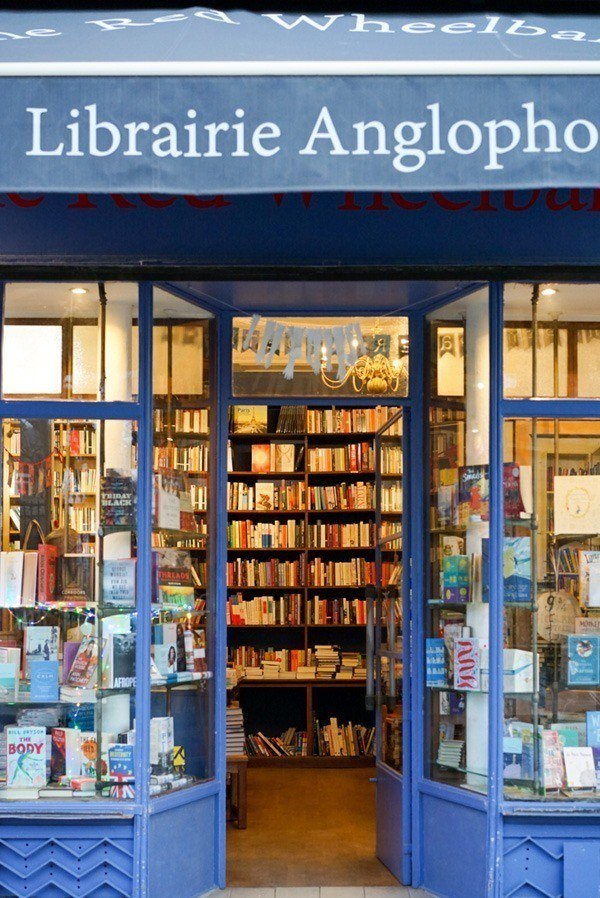 A local bookstore where authors can plan a book signing event. Author signing books in a bookstore.