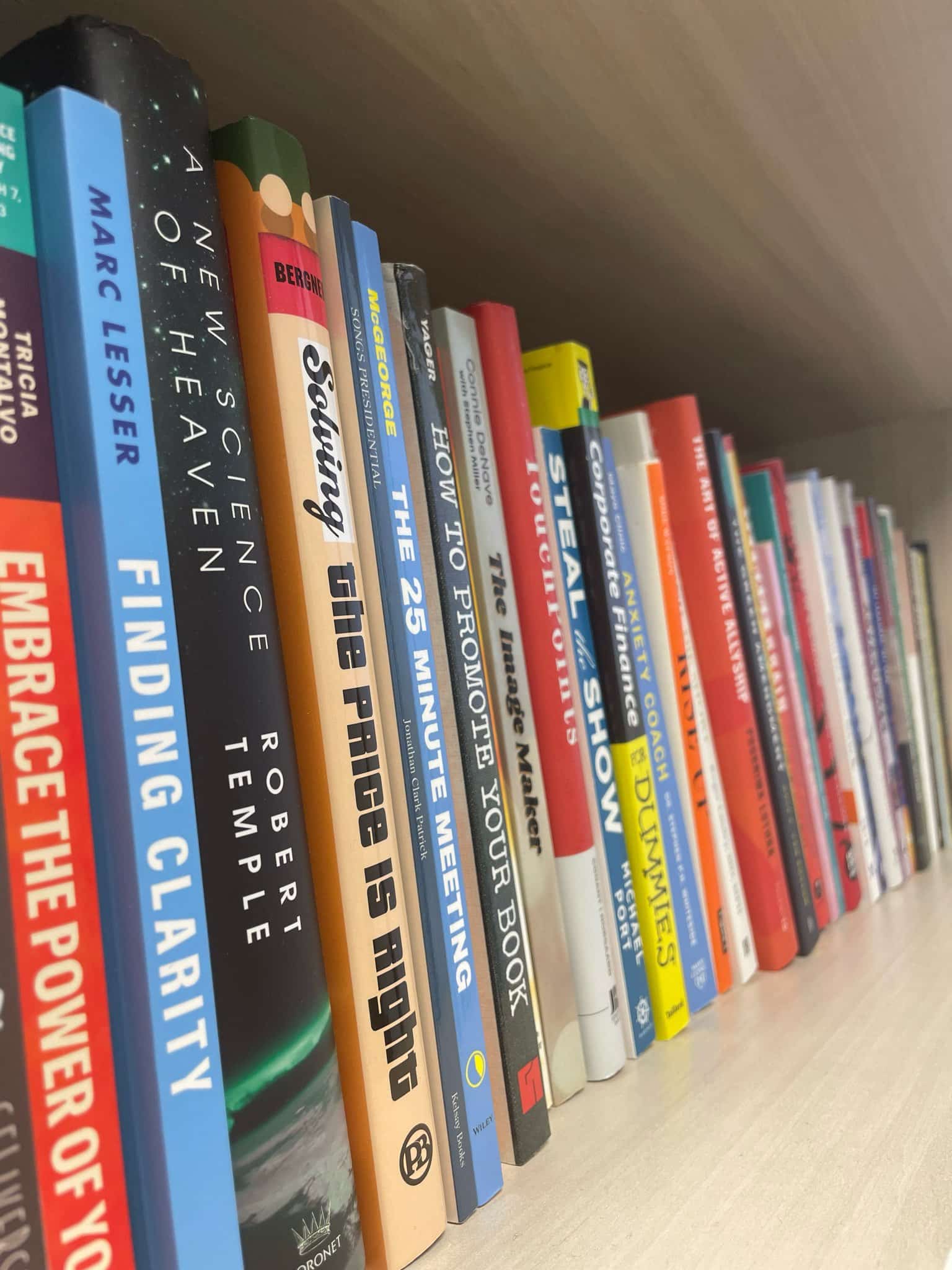 Stack of books on a shelf. How authors promote their books affects book sales.