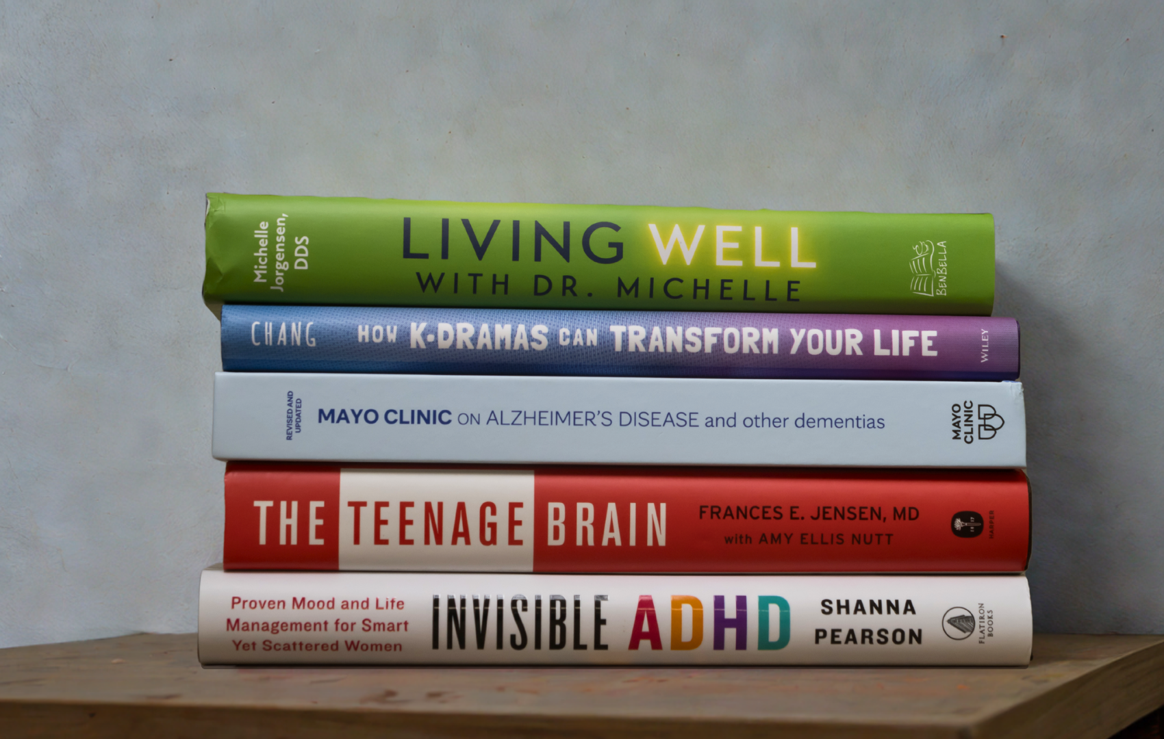 a stack of books on lifestyle and wellness