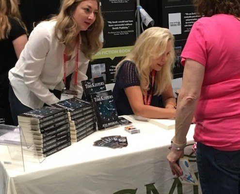 Sarah Miniaci managing client book signing, BookExpo 2018. Smith Publicity client author at a book signing event at bookexpo.